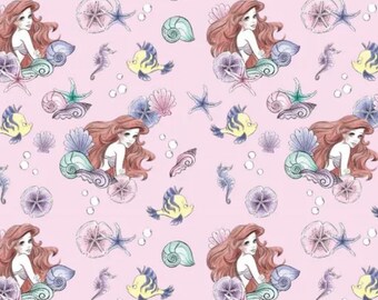 May include: A repeating pattern featuring mermaids with red hair, seashells, starfish, seahorses, and yellow fish on a light pink background. The illustrations have a watercolor style, creating a whimsical and dreamy aesthetic.