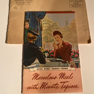 May include: A vintage cookbook cover with a pink background and red text that reads "Miss Dine - About Town Marvelous Meals with Minute Tapioca". The cover features an illustration of three women sitting at a table outdoors.