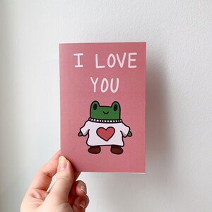 Carte de Saint-Valentin confortable Freg | Carte de Saint-Valentin animale mignonne | Carte d’anniversaire confortable | Carte de voeux d'amour vierge