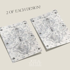 May include: Two rectangular, patterned designs with a vintage aesthetic. The designs feature a detailed, symmetrical pattern in shades of gray and white. The text "2 OF EACH DESIGN!" is at the top. The logo "JOT & TITTLE VINTAGE TYPEWRITERS" is at the bottom.