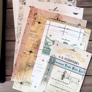 May include: A collection of vintage-style papers with aged textures and faded colors. The papers feature printed text, illustrations of insects, maps, and architectural elements. One sheet displays "Illustrated Trade Price List".