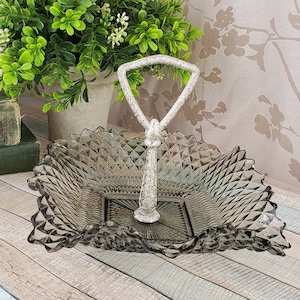 Midcentury smoke grey diamond point tidbit bowl with silver plastic handle, midmod bonbon dish with ruffled edge and finger loop handle