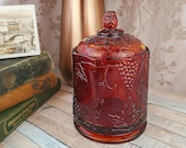 Indiana Glass heavy amberina glass covered octagonal dish, red flashing cylindrical jar, cigar holder, amber glass with grapes and vines