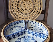 Divided blue floral china dishes in round wicker tray, three sections ceramic china in rattan basket with lid, picnic platter, outdoor tray