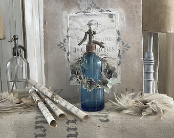 Old blue soda bottle with crowns***