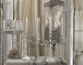 Old candlesticks in white shabby chic style***