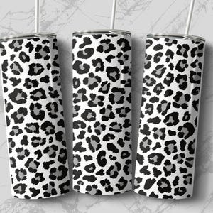 May include: Three stainless steel tumblers with a black and white leopard print design.