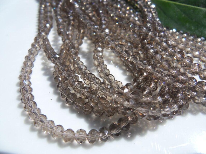 145 Crystal beads 3 x 4 mm SMOKE Rondelle
