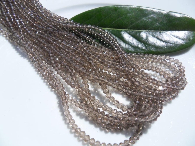 145 Crystal beads 3 x 4 mm SMOKE Rondelle