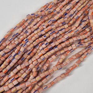 Strand of 100 Indonesian 3-cornered seed beads light rose with stripes Java Beads