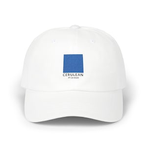 May include: White baseball cap featuring a cerulean blue square with the text "CERULEAN PT 15-4020". The cap has a curved brim and an adjustable strap at the back. A stylish accessory for everyday wear.