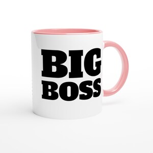 May include: White ceramic mug with a pink interior and handle. The mug features the words "BIG BOSS" in bold, black letters, making it a perfect gift for a boss or leader.
