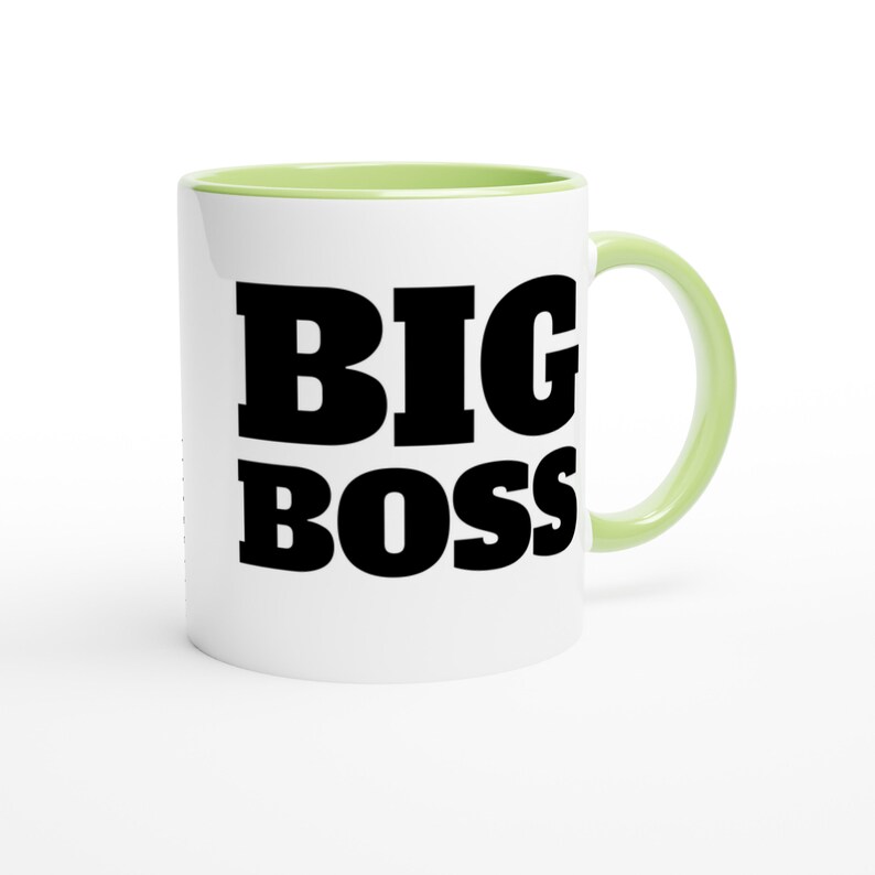 May include: White ceramic mug with a light green interior and handle. The mug features the words "BIG BOSS" in bold, black letters, making it a perfect gift for a boss or leader.