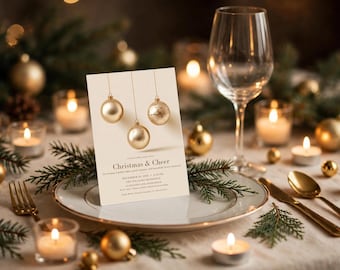 Op de afbeelding: Een rechthoekige, crèmekleurige uitnodigingskaart met drie hangende gouden kerstballen. De tekst luidt Christmas & Cheer, December 29, 2024, 6:30 PM, The Williams Residence, 123 Holiday Lane, Rose Beach, RSVP to the Williams Residence by December 20.