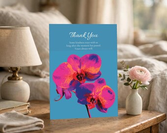 Op de afbeelding: Een rechthoekige wenskaart met een blauwe achtergrond en een illustratie van een felroze en oranje orchidee. De tekst luidt: Thank You. Some kindness stays with us long after the moment has passed. Yours always will.