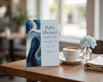 Op de afbeelding: Een verticale rechthoekige kaart met een blauw en goud marmerpatroon aan de linkerkant en tekst aan de rechterkant die luidt Baby Shower honoring Mom-to-Be, Saturday, November 14, 2026, 2:00 PM, The Garden Room, 123 Street, email@example.com.