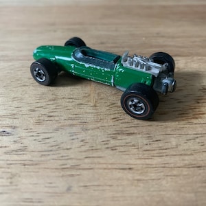 Vintage 1969 hot wheels, redline rash, one green
