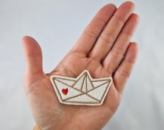 Paper boat patch iron-on application