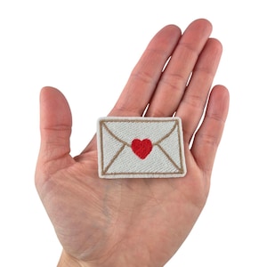 Opstrijkapplicatie met letterpatch