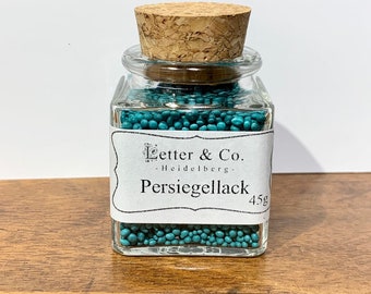 Pearl sealing wax turquoise sealing wax wax in pearl shape in a glass with cork