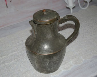 old metal jug