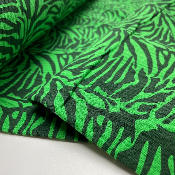 Tissu mousseline double gaze à motif zèbre vert