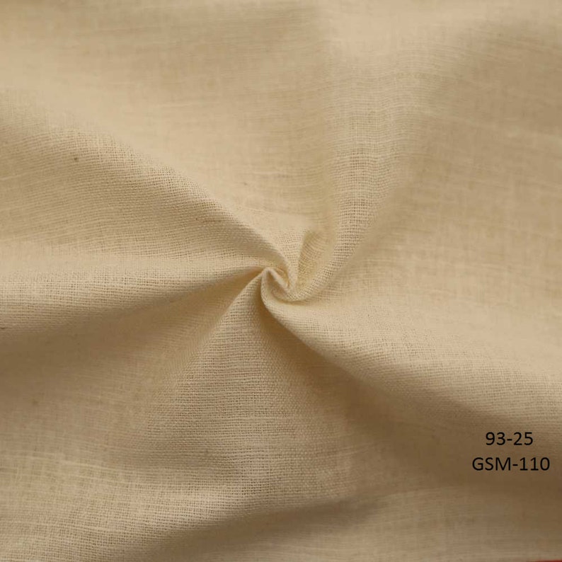 May include: Close-up of a natural off-white fabric with a slightly textured surface. The fabric is folded and draped, showing its soft and drapey quality. The text "93-25 GSM-110" is printed in black at the bottom right corner of the image.