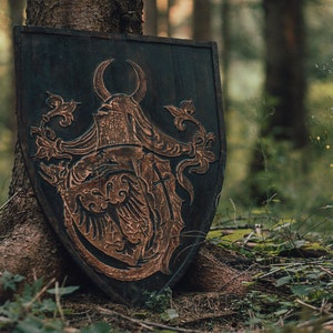 Medieval heather type shield with a crest