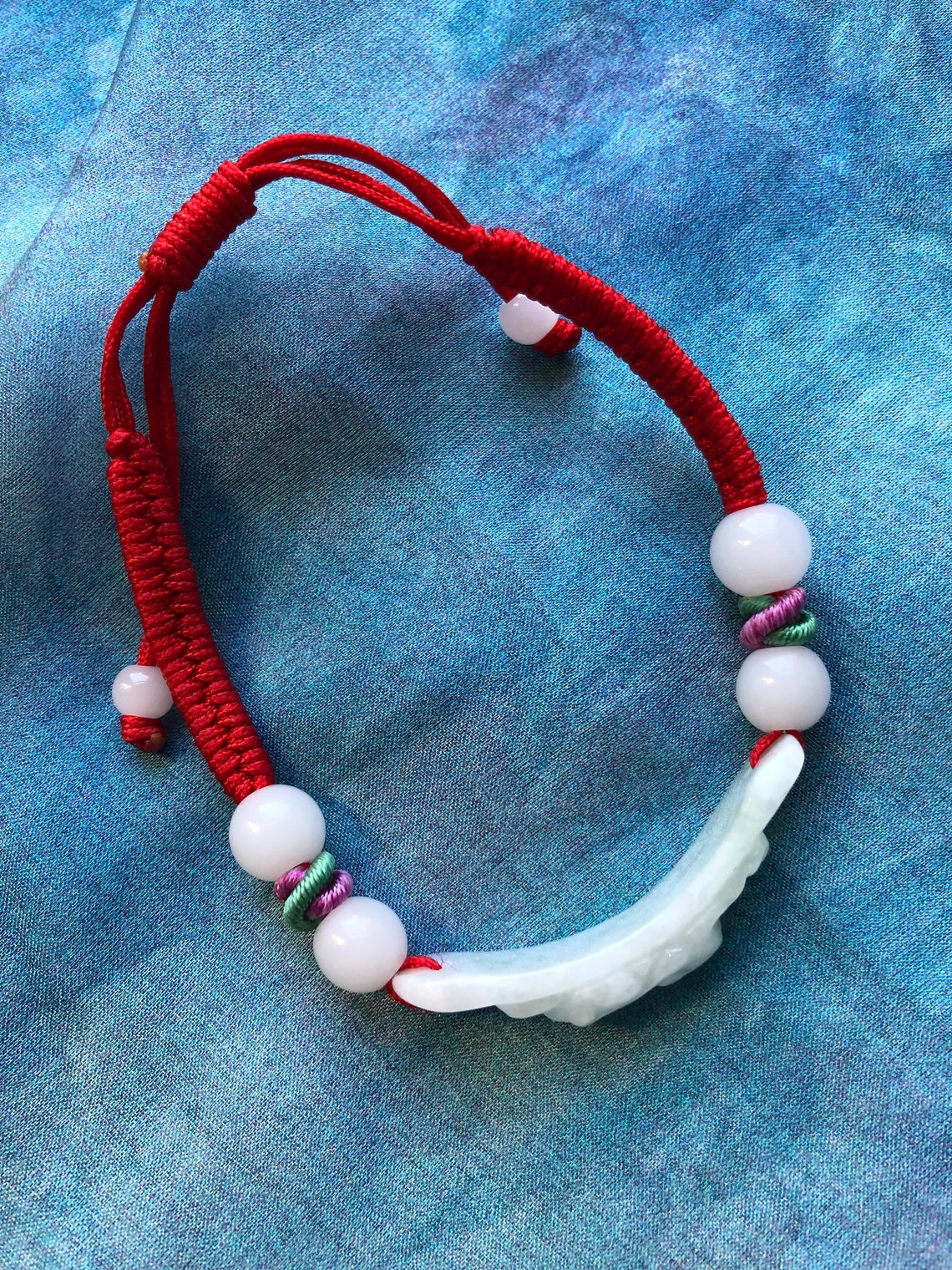 White jade bracelet on a flexible red string Etsy Italia