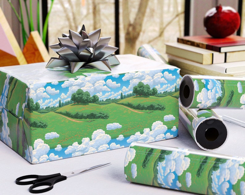 May include: A wrapped gift box with a silver bow, featuring landscape-themed wrapping paper with green hills, blue skies, and fluffy white clouds. Rolls of matching wrapping paper and a pair of black scissors are also visible.