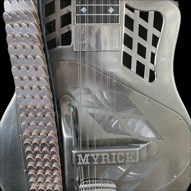 May include: A silver-coloured electric guitar with a metal body and a  "MYRICK" inscription on the front. The guitar has a  grid pattern on the body and a  metal strap.