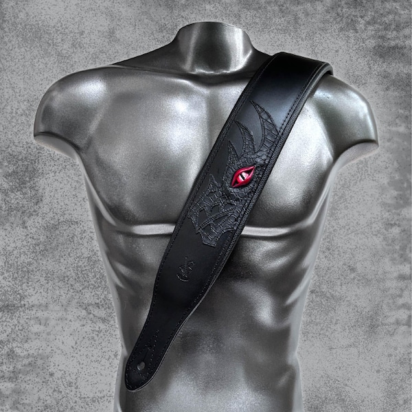 Correa de guitarra de cuero Dragon Eye: acolchada, de cuero negro.