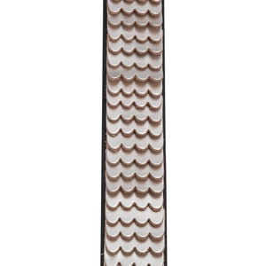 May include: A silver leather bracelet with a scalloped design. The bracelet is attached to a black leather strap.