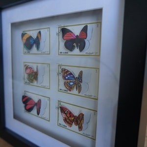 Upcycled butterfly box made from old Umm al-Qaiwain stamps