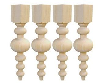 May include: Set of four unfinished wooden table legs with a decorative ball and bead design. Each leg is approximately 16 inches tall.