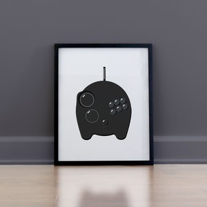 May include: A black and white illustration of a video game controller in a black frame.