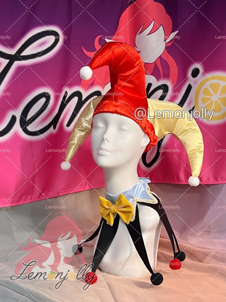 May include: A jester costume on a mannequin head. The costume includes a red and yellow jester hat with white pom-poms, a blue and white collar, a yellow bow tie, and black and white accents. The background has the text "Lemonjolly".