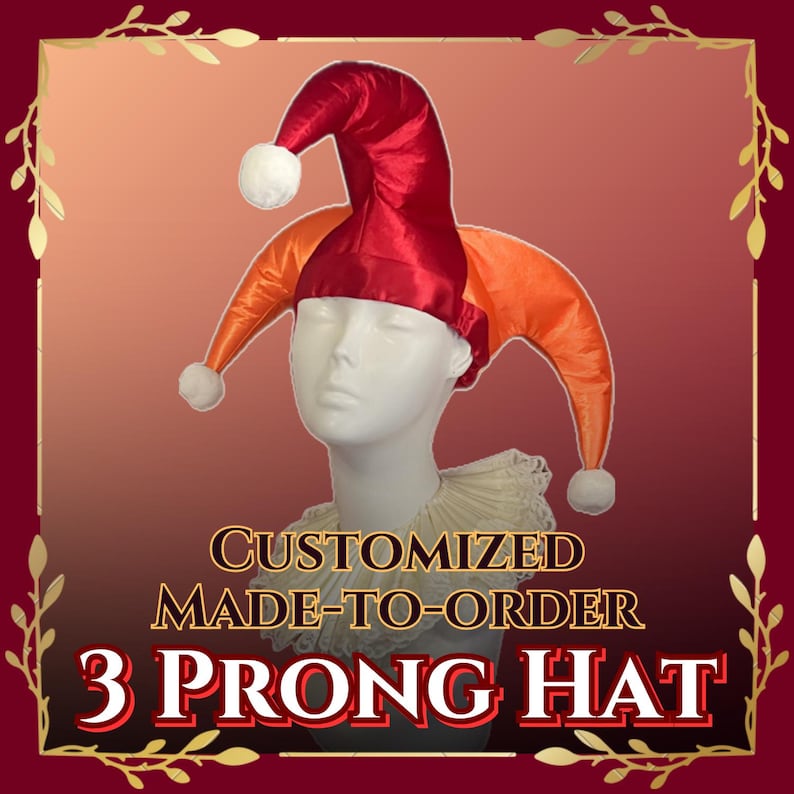 May include: A red and orange 3-prong jester hat with white pom-poms. The hat is made of a shiny fabric and is displayed on a mannequin head. Text on the image reads "CUSTOMIZED MADE-TO-ORDER 3 PRONG HAT."