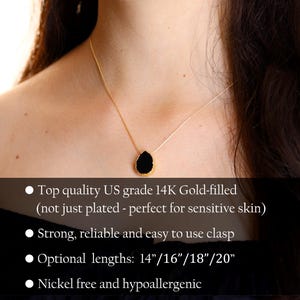 May include: A delicate gold-filled necklace with a black teardrop pendant. The necklace is available in lengths of 14, 16, 18, and 20 inches. It is nickel-free and hypoallergenic.