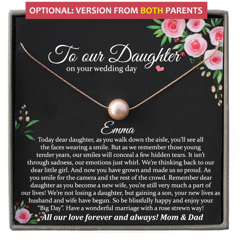 May include: A gold-colored necklace with a single pearl pendant, presented on a black card with floral accents. The card reads "To our Daughter on your wedding day" and includes a heartfelt message from Mom & Dad.