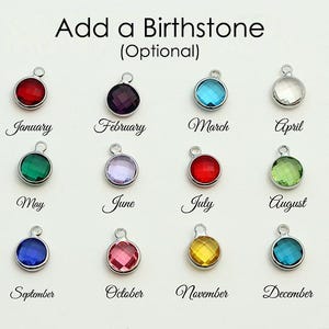 May include: Image of twelve birthstone charms in various colors, each with a silver loop. The months of the year are written below each charm: January, February, March, April, May, June, July, August, September, October, November, and December.