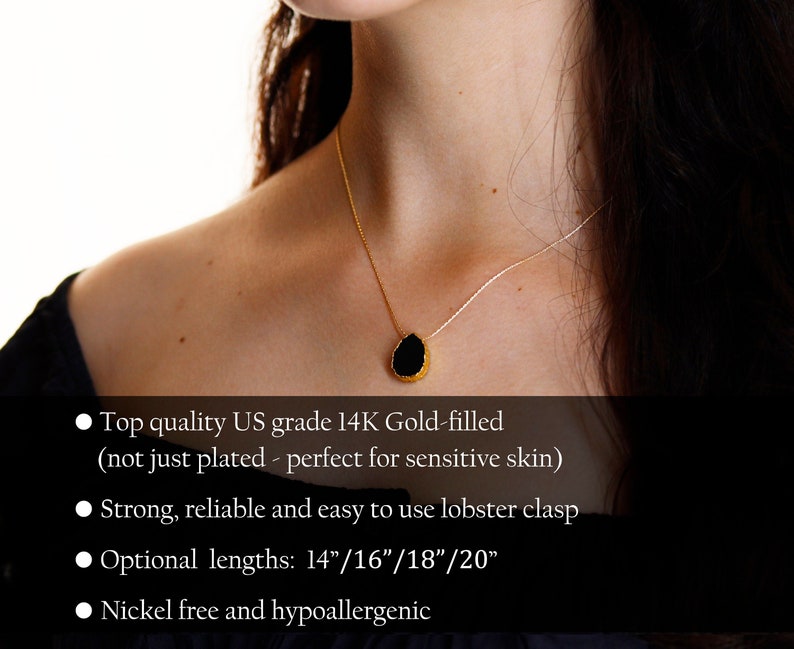 May include: A gold-filled necklace with a black teardrop-shaped pendant. The necklace has a delicate chain and a lobster clasp. Optional lengths are 14", 16", 18", and 20". The necklace is nickel-free and hypoallergenic.