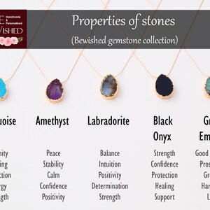 May include: Five gold necklaces with different colored gemstones, each with a label and a list of properties. The stones are turquoise, amethyst, labradorite, black onyx, and green emerald.
