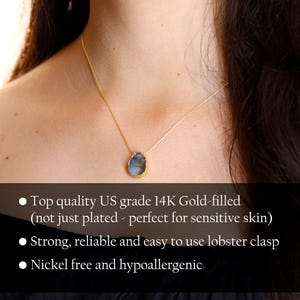 May include: A gold-filled necklace with a teardrop-shaped pendant featuring a blue and grey stone. The necklace is made with high-quality US grade 14K gold-filled material, making it perfect for sensitive skin. It features a lobster clasp and is nickel-free and hypoallergenic.