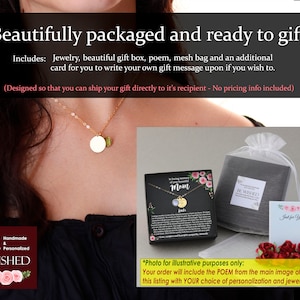 May include: A gold-tone necklace with a circular pendant and a small green gemstone charm. The set includes a black gift box with floral accents and text, a white mesh drawstring bag, and a small white card with the text Just for You.