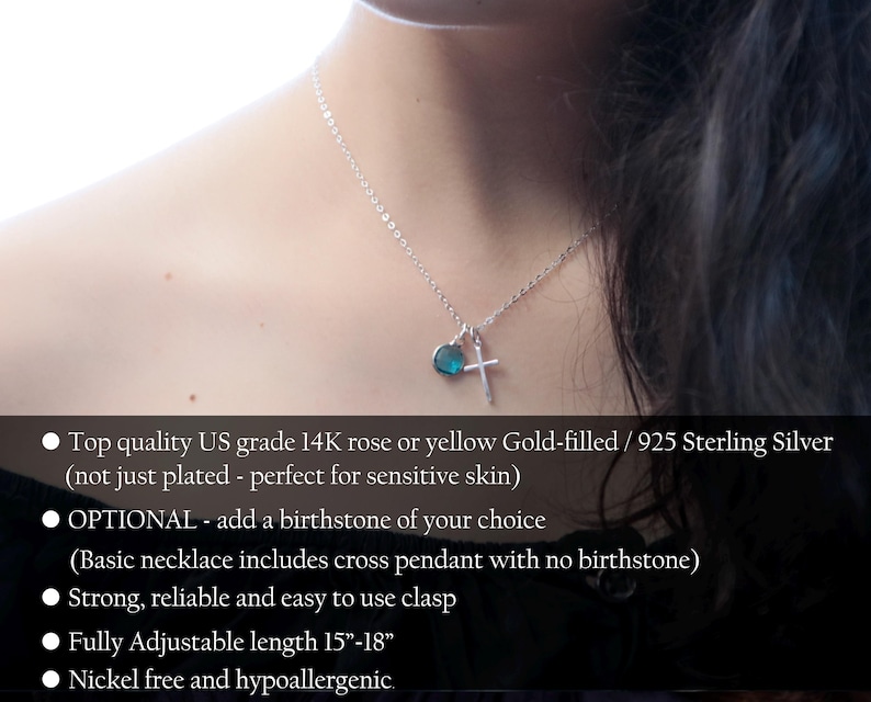 May include: A silver necklace with a cross pendant and a small blue heart-shaped charm. The necklace is shown on a person's neck. The chain is adjustable from 15 to 18 inches.