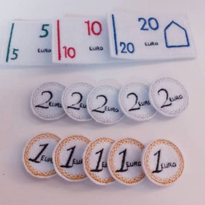 Puede incluir: Un conjunto de parches de fieltro de moneda euro, que incluye billetes de 5, 10, 20 euros y monedas de 1 y 2 euros. Los parches son blancos con bordados negros y de colores.