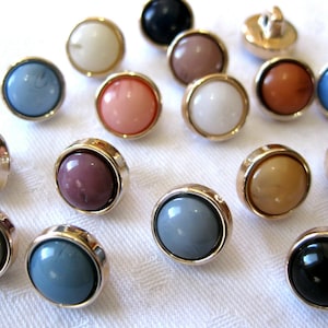 15 buttons, in many colors, color selectable, 10 mm, plastic K116E