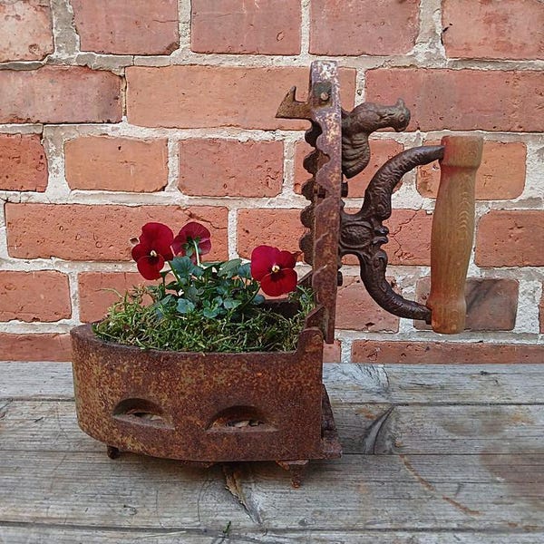 Antique rusty iron with coaster, flat iron, coal iron, cast iron, planter, rust object, garden decoration, vintage garden