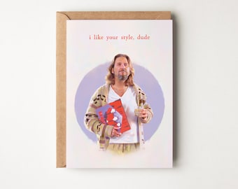 May include: A greeting card featuring a cartoon illustration of a man with long hair and a beard, holding a record and a glass of whiskey. The text on the card reads "i like your style, dude".
